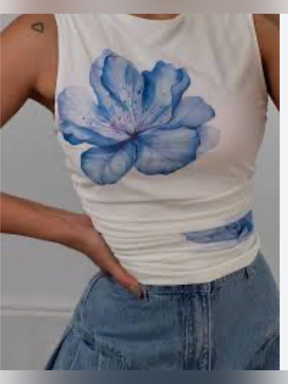 Sleeveless White Top with Blue Floral Print